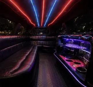 Stretch limo interior with leather seating and bar